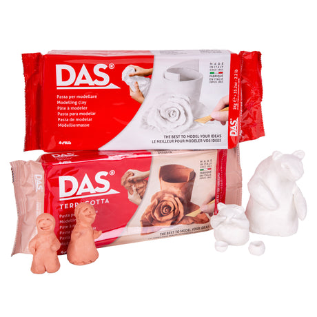 DAS Modelling Clay shown as two packs, white and terracotta, stacked together in red plastic wrap. Beside them, unpainted sample figures made from each clay: two small terracotta people and two white bear-like animals, showing the smooth, workable finish of the air-hardening clay.