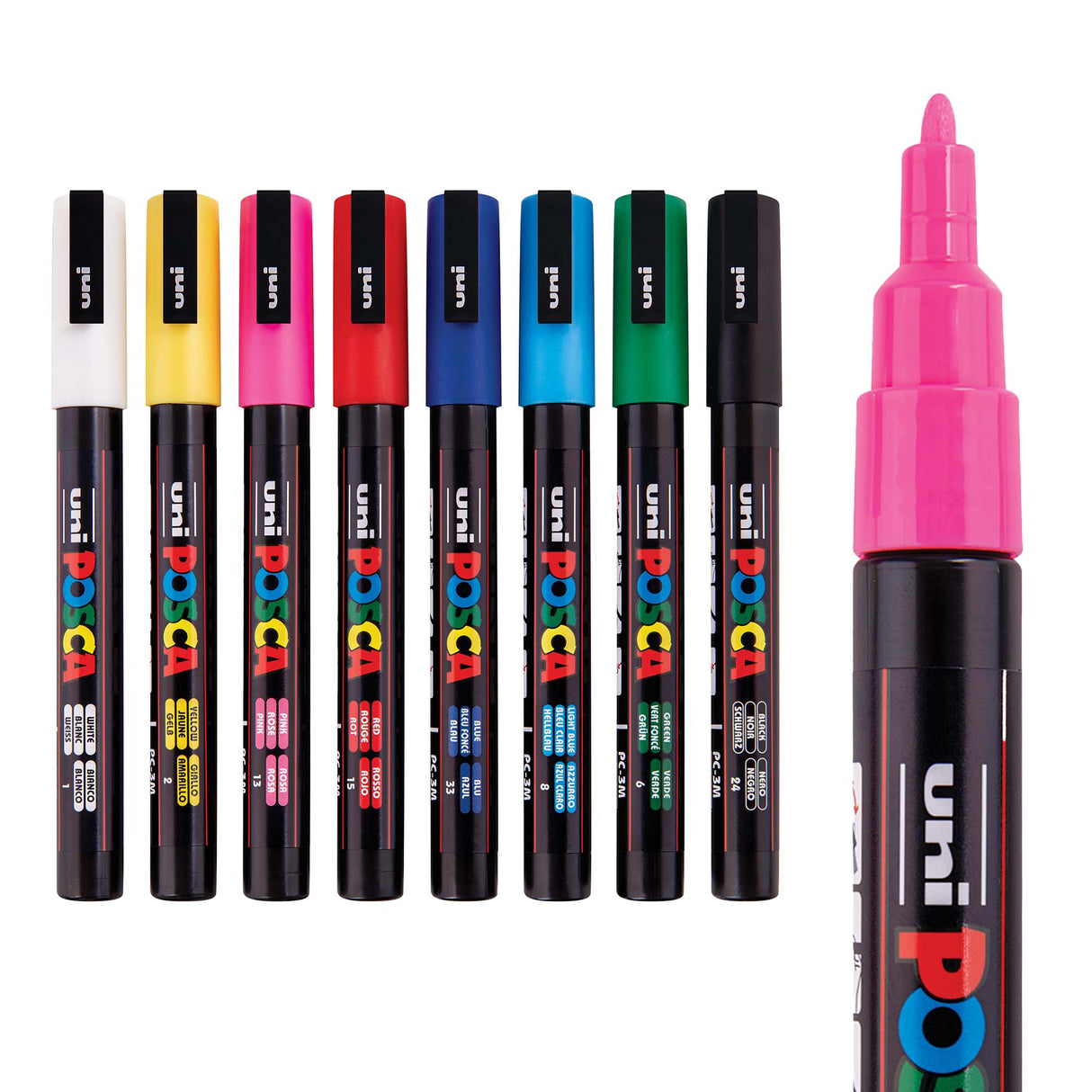 Set of eight POSCA paint markers in assorted colours arranged in a row, with a pink marker shown uncapped on the right to display the fine tip.