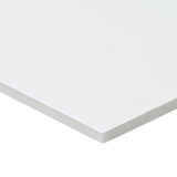 A single A2 sheet of Zart Foam Core Board White shown at an angle against a white background. The smooth white surface and one corner are visible, with the edge revealing the light grey foam core sandwiched between white outer layers.