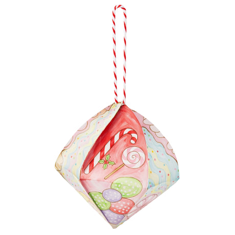 A decorated Zart Cardboard 3D Bauble painted with a Christmas confectionery theme, featuring a candy cane, striped lollipop, holly sprig, and pastel polka-dot sweets against wavy pink, cream, and blue icing patterns. Hung from a red and white twisted cord.