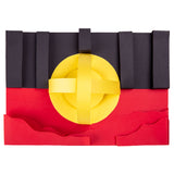 The Aboriginal Flag recreated in Zart coloured card from the Australian Flag Colours pack. Upright black strips form the top half, a flat red base sits below with wavy raised edges, and a yellow circular sun shape with crossed bands sits centred across the join between the two colours.
