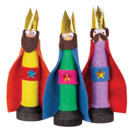 Three decorated figures made using Zart Wooden Peg and Stand pieces, dressed as kings with felt beards, gold foil crowns and coloured felt robes in yellow, green and purple, each with a jewelled star belt and Joggle Eyes, standing on dark wooden bases.