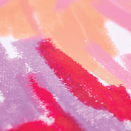 Close-up of layered Warm Earth Slicks colour strokes on paper. Pink, peach, purple and red tones overlap, revealing the creamy, blendable texture and soft matte finish.