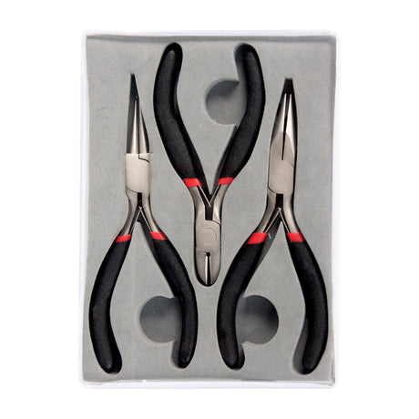 The Zart Jewellery Plier Set of three presented in a grey moulded tray inside a clear plastic case. All three pairs have black foam grips with red bands, arranged with jaws upward — round nose, flat nose and a central pair of diagonal cutters.