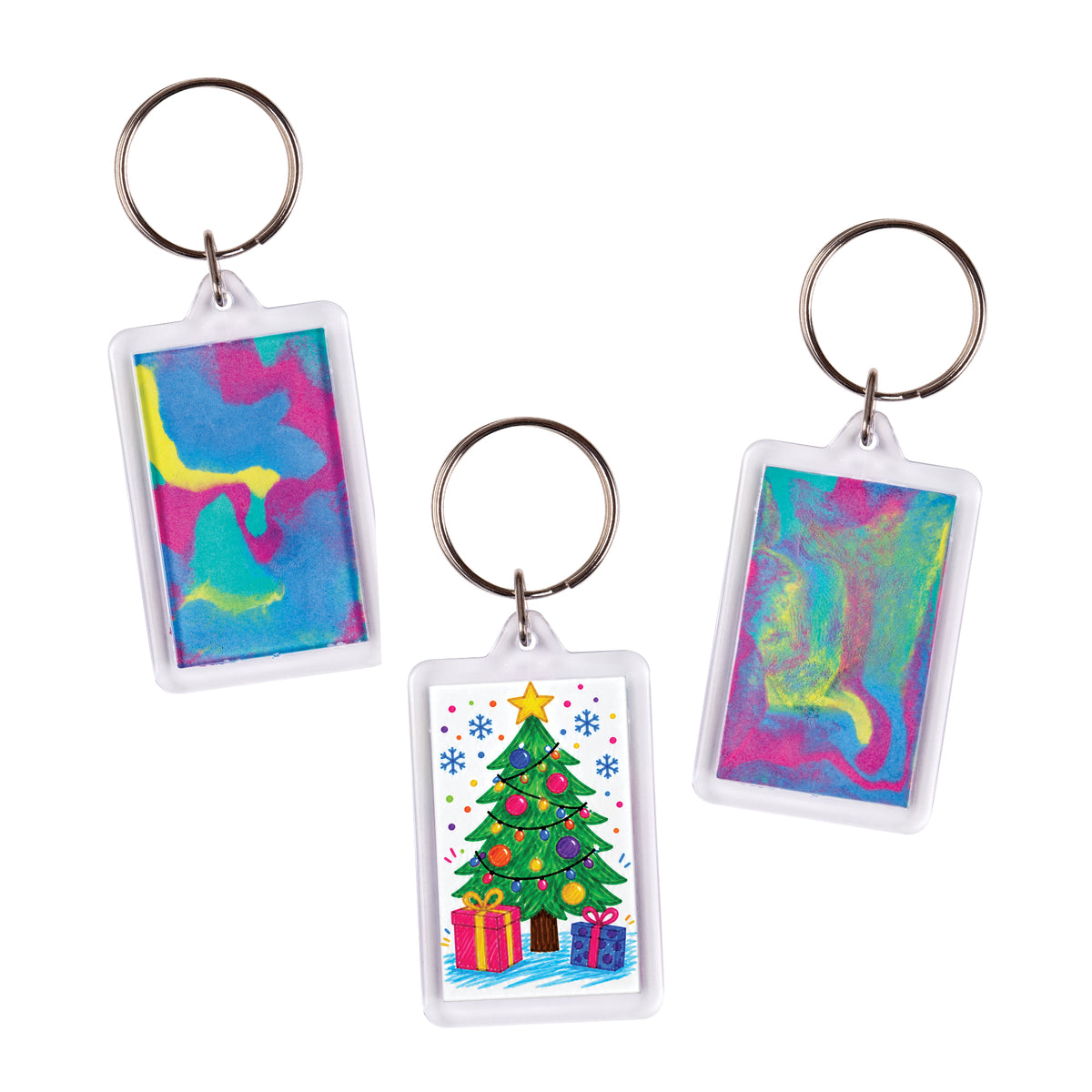 Three Zart Rectangle Key Ring Tags shown as sample artworks with decorative inserts. The left tag displays a swirling blue, pink, and yellow abstract colour pattern. The centre tag features a colourful illustrated Christmas tree with gifts. The right tag shows a blended pink, blue, and green swirl design.