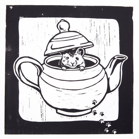 Black and white lino print depicting a mouse peeking out from inside a teapot with the lid raised. Bold black outlines define the form, while vertical carved lines create background texture. Small paw prints appear in the lower right corner.