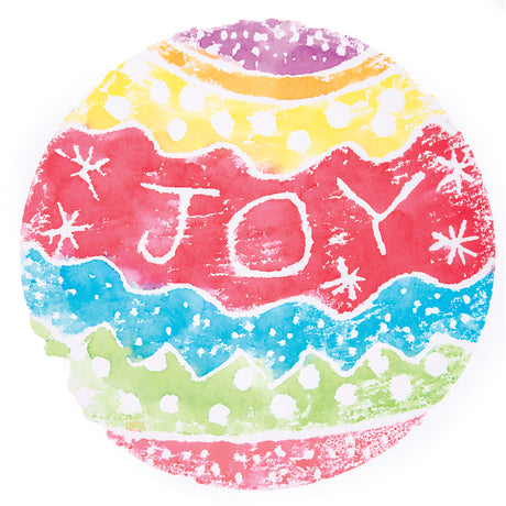 A round watercolour print made with a Zart Printing Foam Round, showing a radial pattern in purple, orange, yellow, red, blue, and green bands. White negative-space lines form snowflakes and the word "JOY" across the red band, with dotted textures scattered throughout each coloured section.