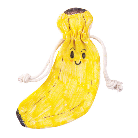 A Zart Calico Stocking decorated as a smiling banana, coloured entirely in yellow with black shading lines, a dark stem tip and a simple happy face with blush marks. The stocking's natural drawstring cords remain visible at the neck.