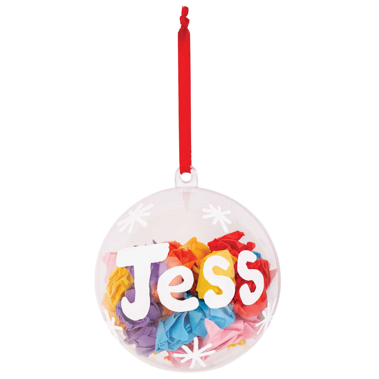 A Zart Plastic Bauble decorated as a sample keepsake, filled with scrunched rainbow tissue paper in pink, orange, yellow, blue and purple. White paper letters spelling "Jess" and small white snowflake dots are stuck to the clear surface, hung from a red ribbon loop.