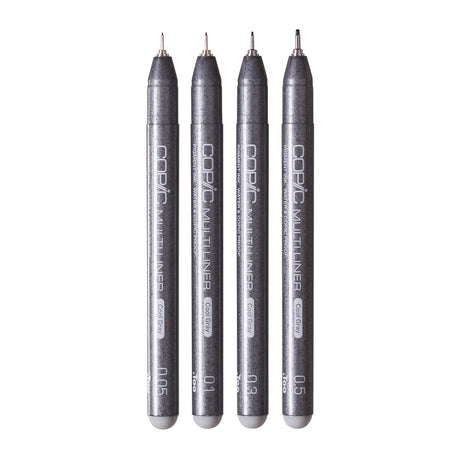 Four Copic Multiliner Cool Gray pens stood vertically side by side, displaying nib sizes 0.05, 0.1, 0.3, and 0.5. Each pen features a dark speckled grey barrel labelled "Copic Multiliner" and "Pigment Ink, Water & Copic Proof", with a light grey barrel end and fine metal nib tip.