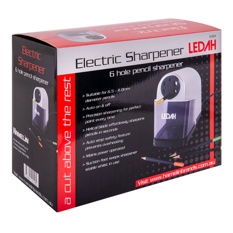 The retail packaging for the Ledah Electric Pencil Sharpener is displayed with product photography and feature information printed across the box. Visible text includes “Electric Sharpener”, “6 hole pencil sharpener” and specifications describing precision sharpening, auto stop safety features and suitability for pencils from 6.5–11mm diameter.