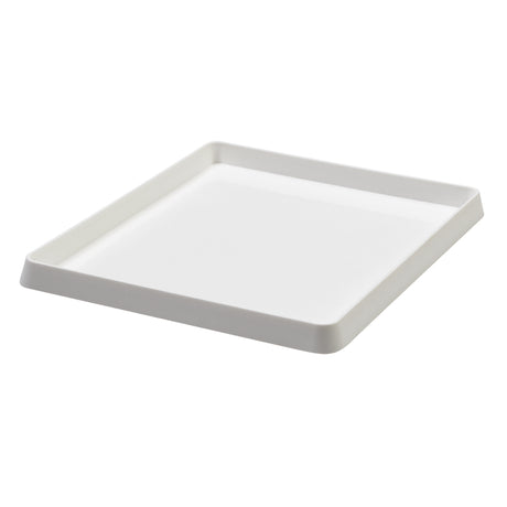 White plastic ink tray displayed at an angled perspective, showing its shallow depth and gently sloped sides. The smooth matte surface and rounded corners are visible, with raised edges forming a neat lip around the tray’s perimeter against a light grey background.