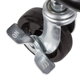 Close-up of one of the trolley's swivel castors, showing a black rubber wheel in a bright zinc-plated metal housing. The metal brake lever is embossed with "ON" and "OFF" markings, indicating how to lock and release the wheel to hold the trolley steady.