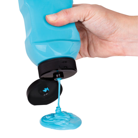 Hand holding a clear plastic bottle filled with blue liquid, dispensing smoothly through the silicone valve in the black lid. The non drip design allows controlled flow, demonstrating mess-free application for paints, dyes, mediums and other liquids.