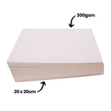 A stack of Zart Card Squares White shown at an angle with two dimension annotations. "300gsm" points to the smooth white surface of the top sheet, and "20 x 20cm" points to the edge of the stack indicating the card dimensions.