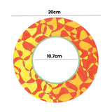 A hand-coloured sample made using a Zart ColourMe Wreath, filled in with a swirling orange and yellow pattern and a green-outlined centre ring. Dimension labels mark the wreath at 20cm outer diameter with a 10.7cm centre cut-out.