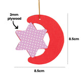 A red crescent moon Zart Wooden Christmas Shape with a polka-dot purple star cut-out insert, shown on a gold cord. Labels indicate the shape measures 8.5cm by 8.5cm and is made from 2mm plywood.