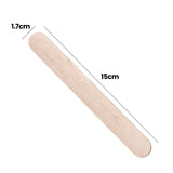 A single Popstick Natural - Giant wooden craft stick is shown diagonally on a pale grey background with black measurement annotations. Text reads “1.7cm” and “15cm”, connected by dotted guide lines. The smooth timber surface shows subtle natural wood grain and pale beige colouring.