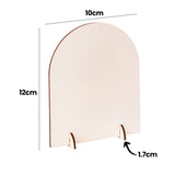 A single blank Zart Desktop Message Board in natural wood tone, shown at an angle with its two small support legs attached to the flat base, allowing it to stand upright. Dimension labels indicate 10cm width, 12cm height and 1.7cm leg depth for reference.