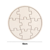 A single blank Zart Mini Jigsaw Round puzzle in natural wood tone, showing the plain scored piece outlines against the pale surface. A dotted line beneath indicates the 10cm diameter of the puzzle.