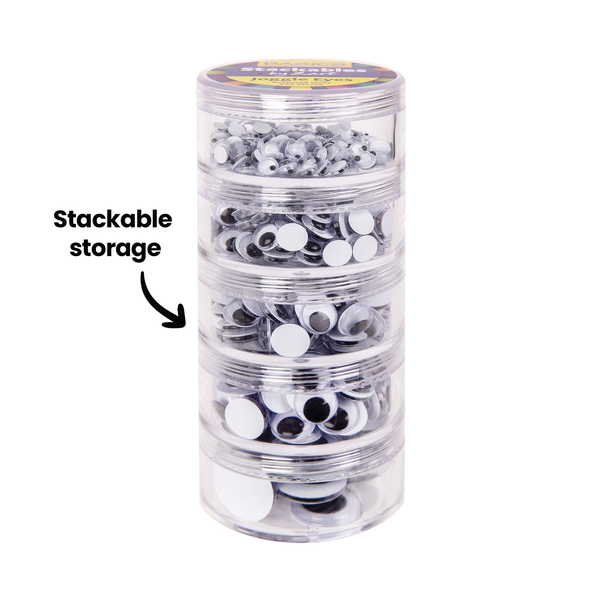 A five-tier stackable tower of Zart Joggle Eyes, each clear cylindrical section filled with a different size, topped with a printed lid labelled "Stackables by Zart Joggle Eyes". The annotation "Stackable storage" with an arrow points to the connected tower of containers.