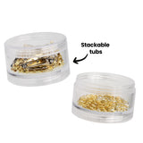 Two clear cylindrical screw-top containers from the Zart Jewellery Findings Stackable Pack, shown separated. The upper container holds gold and silver brooch backs; the lower contains gold jump rings. An annotation reads "Stackable tubs" with an arrow pointing to the containers.