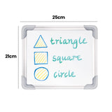 A Zart magnetic whiteboard with the silver frame and grey corners, annotated "25cm" across the top and "21cm" down the side. The surface shows a blue triangle, square and circle filled with yellow, each labelled in green marker: "triangle", "square" and "circle", demonstrating classroom use.