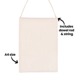 A plain A4 calico banner in natural off-white fabric, suspended by twine. Two annotations point to features: "A4 size" with an arrow indicating the banner dimensions, and "Includes dowel rod & string" pointing to the top hanging mechanism.