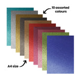 A fanned stack of Zart Glitter Iron-On Sheets in teal, silver, gold, black, bronze, red, burgundy, pink, green and blue, annotated '10 assorted colours' pointing to the range, and 'A4 size' indicating the sheet dimensions. Each sheet displays a fine, even glitter texture.