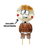 A mixed media character artwork uses a Paper Plate as the face, with drawn glasses, red cheeks, textured hair and patterned clothing beneath. Black annotation text reads “Use with Mixed Media” with a curved arrow pointing towards the decorated plate face.