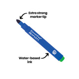 A single blue Micador Colourfun Marker is displayed diagonally against a pale grey background with black annotation text reading “Extra strong marker tip” and “Water-based ink”. The marker features a rounded dark blue tip, glossy barrel surface, and bright green end cap.