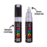 Two POSCA Metallic Markers in silver, one capped and one uncapped showing its flat chisel-shaped nib. The annotations "Opaque coverage" and "8mm Chisel nib" point to the barrel and tip respectively, both marked with an arrow.