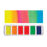 Product image of Creamy Colours Watercolours by Zart Fluorescent showing six watercolour pans arranged in a silver metal tray beneath matching colour swatches. Fluorescent yellow, orange, pink, red, green and blue tones blend softly at the edges, highlighting the vivid, highly saturated colour palette.