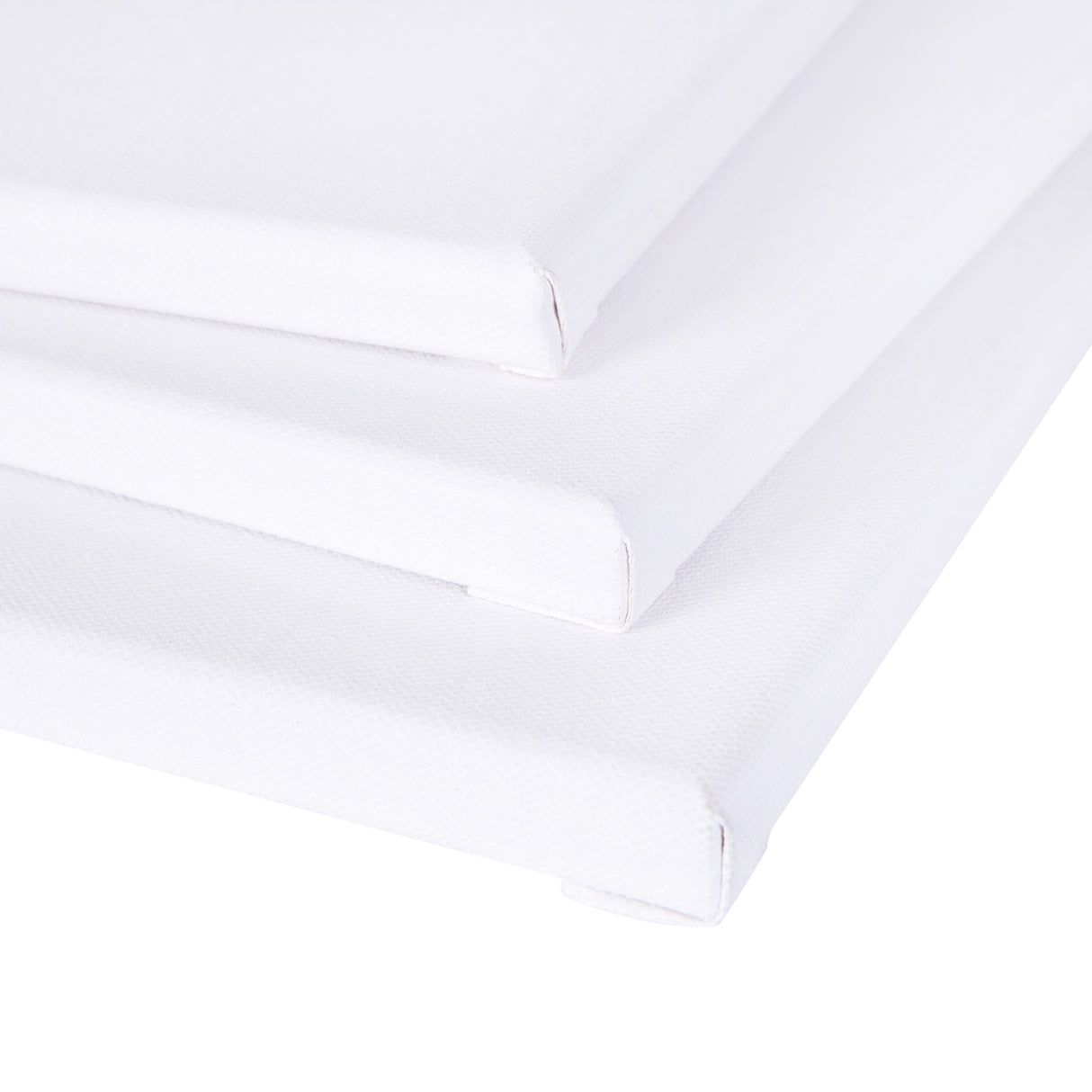 Three blank Zart stretched canvases stacked at an angle, viewed from the corner to show their thin profile and depth. The white primed surface wraps neatly around each edge, with the folded corners and stapled sides visible along the stacked stretcher frames.