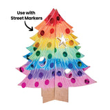 A Zart Papier-mache 3D Christmas Tree coloured in a rainbow marker gradient from red at the top through orange, yellow, green, blue, and pink at the base, decorated with matching foil sequins and a white star cut-out, annotated "Use with Street Markers".