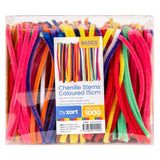 Basics Chenille Stems Coloured 15cm in a clear rectangular box, packed full of assorted fuzzy stems in pink, red, orange, green, purple and yellow. The blue and white "by zart" label shows a colour sample and "Pack of 1000" in an orange corner flash.