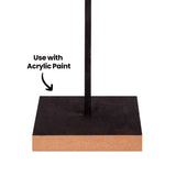 A close-up of a Zart Wooden Base with its top surface painted black and a thin black rod fixed upright through a centred hole, natural pale wood visible along the raw edge. The annotation "Use with Acrylic Paint" points to the painted top surface.