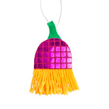 A hanging decoration made with Zart Mirror Pattern Felt in a magenta and pink checked grid, topped with a curved green felt stem and string loop. Below the mirrored panel, loose orange and yellow yarn strands hang in a fringed tassel, swaying freely at the base.