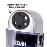 A close-up view of the Ledah Electric Pencil Sharpener focuses on the six-hole sharpening selector on the silver housing above the transparent shavings tray. Black annotation text reads “Sharpens pencils up to 11mm in diameter”, highlighting compatibility with a range of standard and larger drawing pencils.