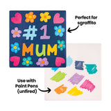 Two Ceramic Bisque Tile 15.24cm (6") samples. One is painted navy with colourful "#1 MUM" lettering, flowers and hearts, annotated "Perfect for sgraffito". The other shows bright marker swatches in green, purple, pink, orange and yellow, annotated "Use with Paint Pens (unfired)".