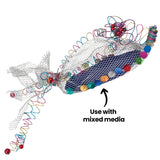 A fish-like form constructed from Flex-it Mesh (Medium), layered over a blue core and decorated with colourful coiled wires and sequins. The silver mesh surface appears airy and net-like. Annotation text reads: “Use with mixed media”.