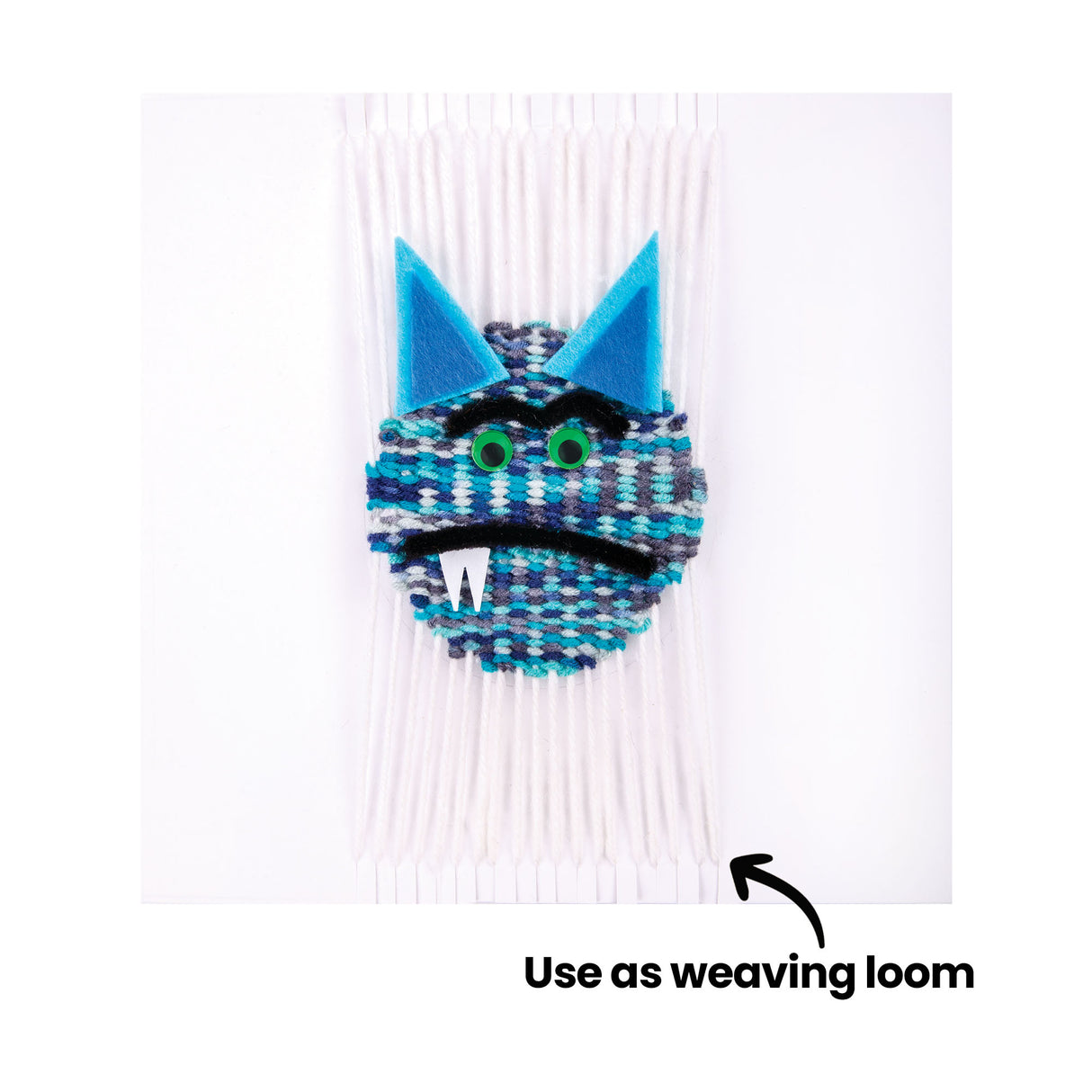 A sample artwork showing a card square used as a weaving loom, with yarn woven across the surface in blue, grey, teal, and white to create a monster face design with green Joggle Eyes, blue felt ears, and a black pipe cleaner mouth. An annotation reads "Use as weaving loom."