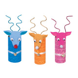 Three brightly coloured cardboard tube reindeer artworks are displayed against a light grey background. The textured tubes feature embossed patterns in blue, orange and pink, with wavy wire antlers, googly eyes, pom pom noses, ribbon collars and small metallic bells attached at the front.