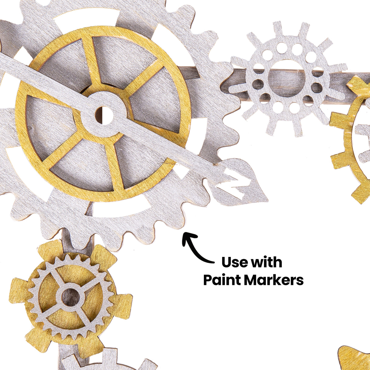 A close-up view of painted Zart Wooden Gears and Cogs Assorted pieces shows metallic silver and gold finishes applied to the laser-cut timber shapes. Black annotation text reads “Use with Paint Markers”, highlighting how the wooden pieces can be customised with colour and mixed media techniques.
