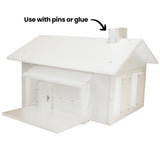 White foam structure assembled into a geometric model with flat panels and sharp edges. On-image text reads “Use with pins or glue”. Small fastenings are visible, contrasting against the matte white surface.