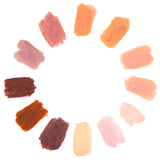 Colour swatches created with Zart Skin Tone Slicks arranged in a circular palette. Twelve blended swatches range from deep browns to warm oranges, peach, blush and pale cream.