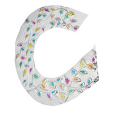 Curved sheet of aluminium foil embossed with flowing vine patterns and raised leaf shapes. Each leaf is filled with bright translucent colours including yellow, pink, blue, green and orange. The reflective metallic surface enhances texture, depth and dimensional detail.