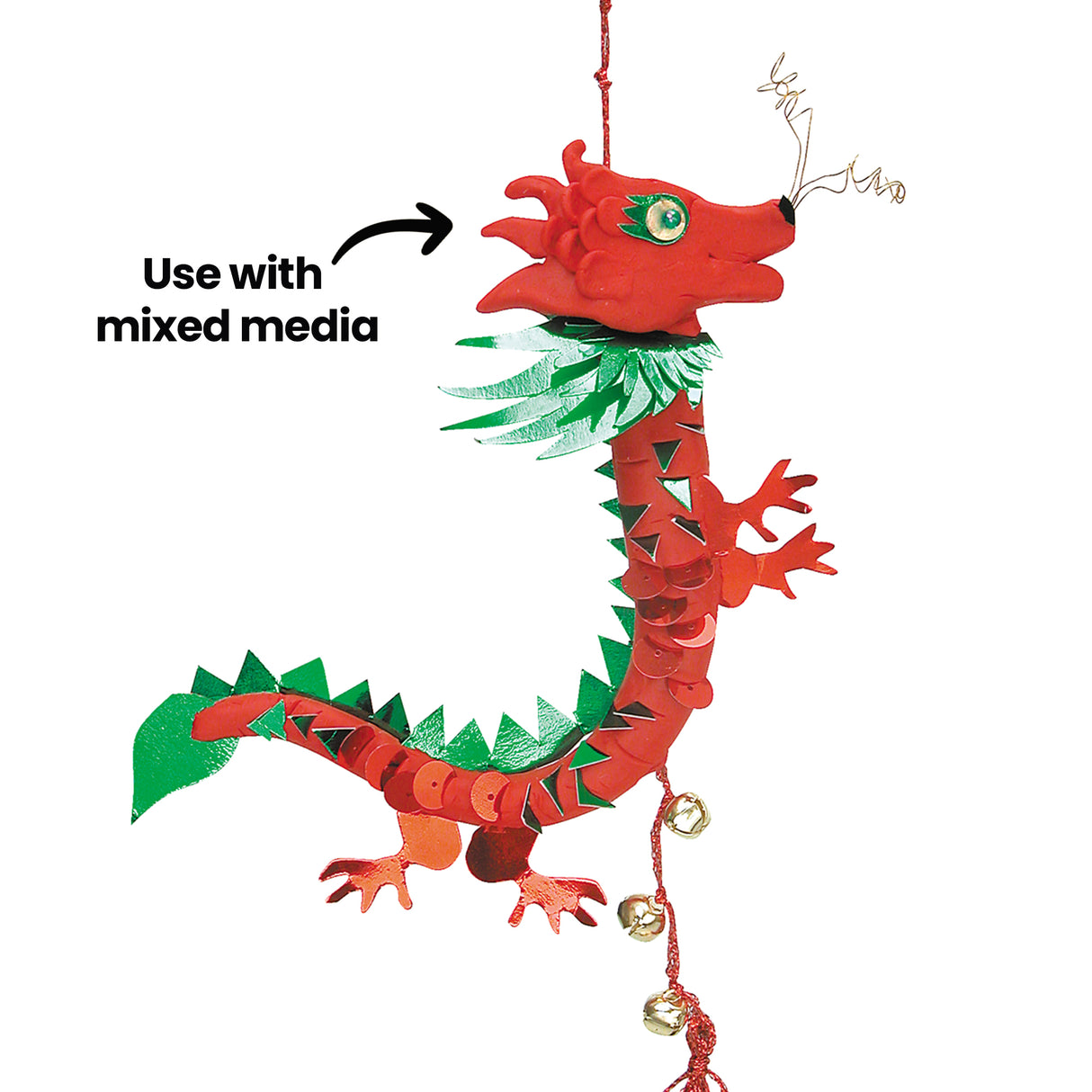 Red Plasticine dragon with a soft, slightly textured surface and subtle sheen. Bright red body contrasts with reflective green paper shapes and shiny sequins. Curled form features layered textures, combining smooth modelling with crisp mixed media elements. Annotation text reads “Use with mixed media” with arrow pointing to dragon.