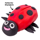 Close-up of a red Plasticine ladybird model with black spots and a black head, featuring smooth curved surfaces and a soft sheen. Fine texture from shaping is visible across the body. Annotation text reads “Perfect for 3D projects”.