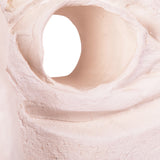 Extreme close-up of a clay eye opening, highlighting the smooth interior surface and slightly textured exterior, showing the material’s workable consistency.